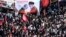 Tehran, Iran - Iranian people attend a funeral procession for Iranian Major-General Qassem Soleimani, head of the elite Quds Force, and Iraqi militia commander Abu Mahdi al-Muhandis, who were killed in an air strike at Baghdad airport