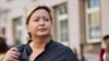 Russia -- Olga Romanova, the director of Rus Sidyashchaya (Russia Behind Bars), stands outside a Moscow court, August 18, 2014