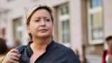 Russia -- Olga Romanova, the director of Rus Sidyashchaya (Russia Behind Bars), stands outside a Moscow court, August 18, 2014