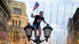 RUSSIA -- A Russia's fan celebrates after Russia won the Russia 2018 World Cup round of 16 football match against Spain, in central Moscow, July 1, 2018