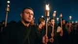 Armenia -- People hold candles during a rally in Yerevan, Armenia