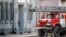RUSSIA -- A Russian firefighter walks near a fire-engine at building housing the FSB security service in Arkhangelsk, October 31, 2018