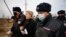 RUSSIA -- Russian police officers detain Anastasiya Vasilyeva, a doctor and ally of Kremlin critic Aleksei Navalny, near the IK-2 corrective penal colony, where Navalny serves his jail term, in the town of Pokrov, April 6, 2021