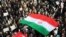 IRAN -- Iranian pro-government supporters march during a rally in support of the regime after authorities declared the end of deadly unrest, in the city of Mashhad on January 4, 2018.
