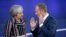 BELGIUM -- British Prime Minister Theresa May (L) and European Council President Donald Tusk talk during the familly picture at the Asem 12, Asia-Europe Meeting in Brussels, October 19, 2018