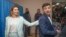 UKRAINE -- Ukrainian Presidential candidate Volodymyr Zelensky reacts as his wife Olena passes by him during Presidential elections at a polling station in Kiev, Ukraine, 21 April 2019. 