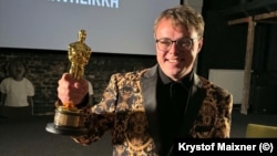 Павел Таланкин со статуэткой "Оскар" в Праге