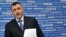 Ukraine -- Deputy Prosecutor-General Renat Kuzmin holds documents prior to his press-conference in Kyiv, 22Mar2011