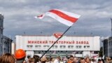 BELARUS – Protest in Belarus nearby Minsk tractor plant, flag of protesters over the factory and workers coming from their shifts, the beginning of a strike. Minsk, August 18, 2020