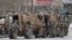AFGHANISTAN -- NATO soldiers inspect near the site of an attack in Kabul, March 25, 2020