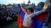 ARMENIA -- A boy holds an Armenian flag during a rally held by supporters of opposition leader Nikol Pashinyan, in the country's second largest city of Gyumri, Armenia April 27, 2018