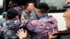 KAZAKHSTAN -- Police detain opposition supporters during a protest calling for free and fair elections during the presidential elections in Nur-Sultan, June 9, 2019