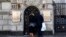 GERMANY -- Two people wait to enter the Russian Embassy in Berlin, December 4, 2019
