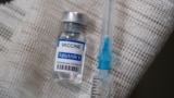 RUSSIA -- A vial labelled "Sputnik V Coronavirus COVID-19 Vaccine" and a syringe - generic
