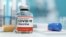 GENERAL – A single bottle vial of Covid-19 coronavirus vaccine in a research medical lab. 3D illustration