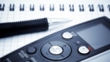 Generic -- Journalist equipment. Digital voice recorder, pen, notebook