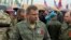 UKRAINE -- The head of the Donetsk People's Republic Alexander Zakharchenko (front) talks to journalists about two bombs that exploded on 8 May 2017 shortly before the cars carrying Zakharchenko and other Donetsk People's Republic officials and journalist