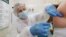 BELARUS -- A patient gets the Russian Gam-COVID-Vak (Sputnik V) vaccine against COVID-19 in a city hospital, in MInsk, December 29, 2020