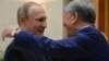 Kyrgyzstan -- Kyrgyz President Almazbek Atambaev (R) embraces his Russian counterpart Vladimir Putin during a Commonwealth of Independent States (CIS) leaders summit at the Ala-Archa state residence in Bishkek, September 16, 2016