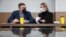 RUSSIA -- Russian opposition activist Lyubov Sobol, right, talks with her lawyer before a hearing in a court in Moscow, March 23, 2021