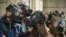 ROMANIA -- Protesters wear gas masks in the front of the Romanian Environment Ministry in Bucharest March 4, 2019, to demand better air.