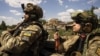 UKRAINE – Ukrainian servicemen of the reconnaissance team ride to the position in the trunk of pickup at the frontline in Mykolaiv region, Ukraine, Augast 8, 2022