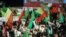 IRAN -- Iranians hold portraits of Iranian supreme leader Ayatollah Ali Khamenei and chant slogans as they take part in a rally to support the government and regime, outside of the Imam Khomeini grand mosque in Tehran, Iran, 30 December 2017