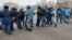 KAZAKHSTAN -- Police officers detain opposition supporters blocking a street during a protest after anti-government activist has died of heart problems in a police detention center, in Nur-Sultan, February 25, 2020