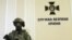Ukraine – Armed soldier during a press conference in the building of the SBU. It has been demonstrated evidence of Russian military involvement in the fighting in the east of Ukraine. Kyiv, July 29, 2015