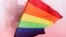 A participant flutters a rainbow flag at the Angel of Independence monument although the Mexican LGBT community called for an online gay pride celebration as a protective measure amid the coronavirus disease (COVID-19) outbreak, in Mexico City, Mexico Jun