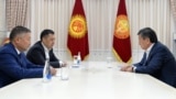 President Sooronbai Jeenbekov (right) meets with Kyrgyzstan's new parliamentary speaker, Kanat Isaev (front left), and prime minister, Sadyr Japarov, in Bishkek on October 14, 2020.