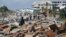 First responders and residents walk along a main street following Hurricane Michael in Mexico Beach, Florida, U.S., October 11, 2018. REUTERS/Carlo Allegri