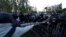 Police and protesters are fighting over a fence set around church construction site in Ekaterinburg