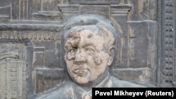 A bas-relief depicting Kazakhstan's first president, Nursultan Nazarbaev, was smeared with mud in Almaty during January 2022 protests triggered by a fuel price increase.