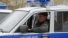 A police officer in a new UAZ Hunter 