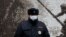 RUSSIA -- A Russian policeman wearing a protective face mask amid the coronavirus disease (COVID 19) outbreak stands guard during a ceremony marking the Day of the Unknown Soldier near a World War Two monument in Stavropol, December 3, 2020