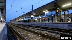 Germany - Passengers wait for their train at the train station in Munich-Pasing during a strike of train drivers' union GDL November 7, 2014