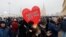 RUSSIA -- A protestor holds a heart-shaped sign reading "I love you, Russia! We are Russia!" during a rally in support of jailed Russian opposition leader Alexei Navalny in Moscow, Russia January 31, 2021. 
