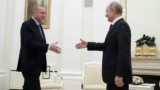 RUSSIA -- Russian President Vladimir Putin approaches to shake hands with Turkish President Tayyip Erdogan during a meeting in Moscow, March 5, 2020