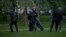 RUSSIA -- Police officers detain demonstrators who protest plans to construct a cathedral in a park in Yekaterinburg, May 14, 2019