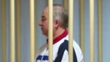 RUSSIA -- Sergei stands behind bars in a courtroom in Moscow, August 9, 2006