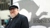 In this March 18, 2013 file photo, author George R.R. Martin arrives at the premiere for the third season of the HBO television series "Game of Thrones" at the TCL Chinese Theatre in Los Angeles.
