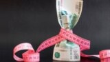 GENERIC – Russian money One hundred rubles with measuring tape on black background
