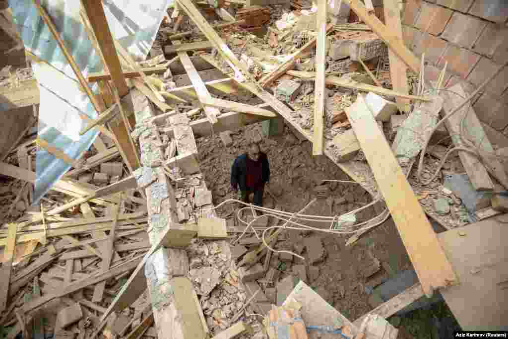 AZERBAIJAN -- Local resident Elsever Pashayev stands in his house that was allegedly damaged by recent shelling during the fighting over the breakaway region of Nagorno-Karabakh, in the city of Tartar, November 2, 2020