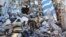 Russia -- Russian Emergency Situations Ministry employees clearing the debris at the site of an apartment building collapse