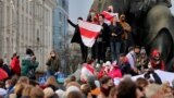 BELARUS -- Demonstrators are seen at the monument to Belarusian writer Yakub Kolas during an opposition rally to reject the Belarusian presidential election results in Minsk, October 26, 2020