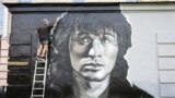 Russia -- A graffiti depictyng a portrait of Viktor Tsoi is seen in the center of Str. Petersburg, August 14, 2014