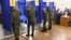Servicemen vote in the 2021 Russian parliamentary election at polling station No 202 at secondary school No 10 in the village of Peschanka