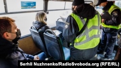 Police check the vaccination certificates of passengers on public transport in Kyiv on November 1.