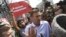 RUSSIA – Russian opposition leader Alexei Navalny, center, argues with fighters of National Liberation movement during a demonstration against President Vladimir Putin in Pushkin Square in Moscow, Russia, Saturday, May 5, 2018